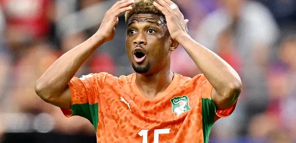 Player in orange jersey reacting during a match