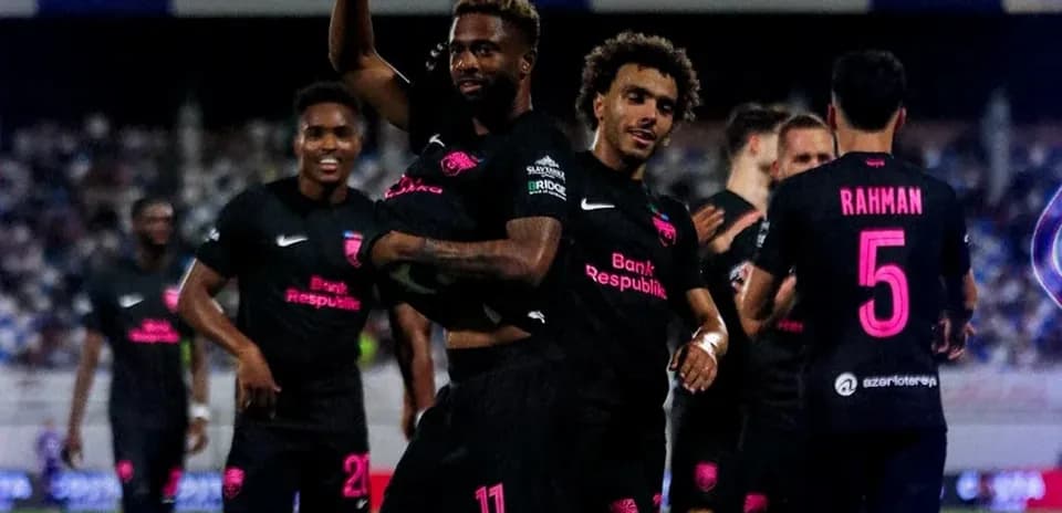 Players celebrating a goal during Champions League match