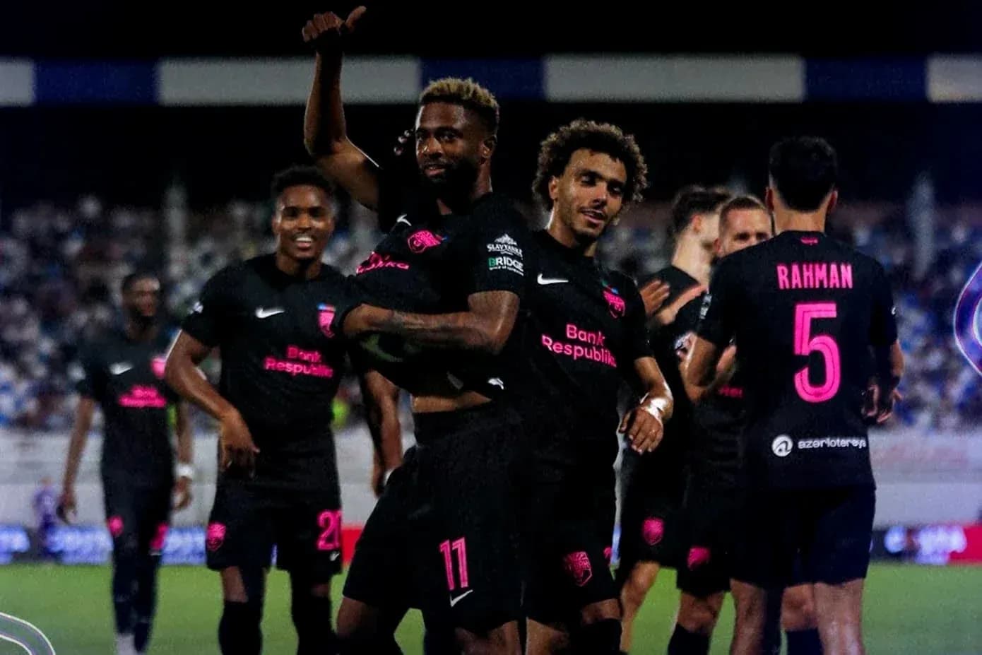Players celebrating a goal during Champions League match