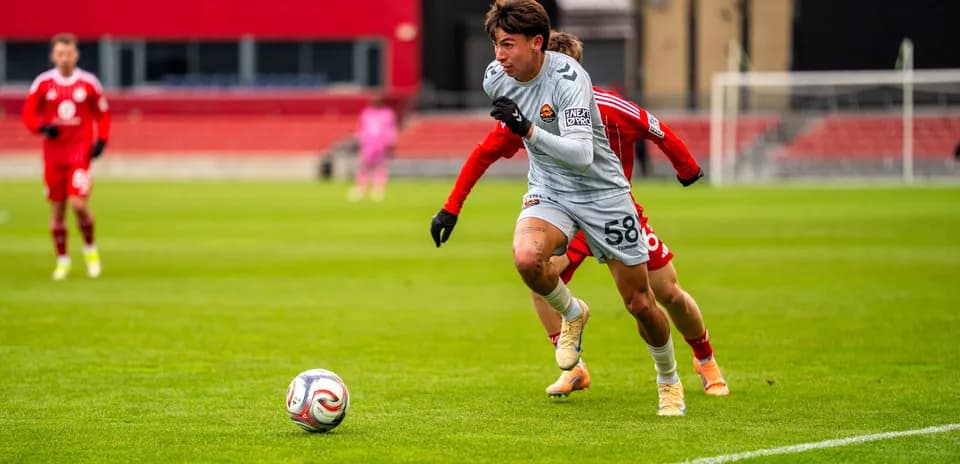 Player chasing the ball during Carolina Core match