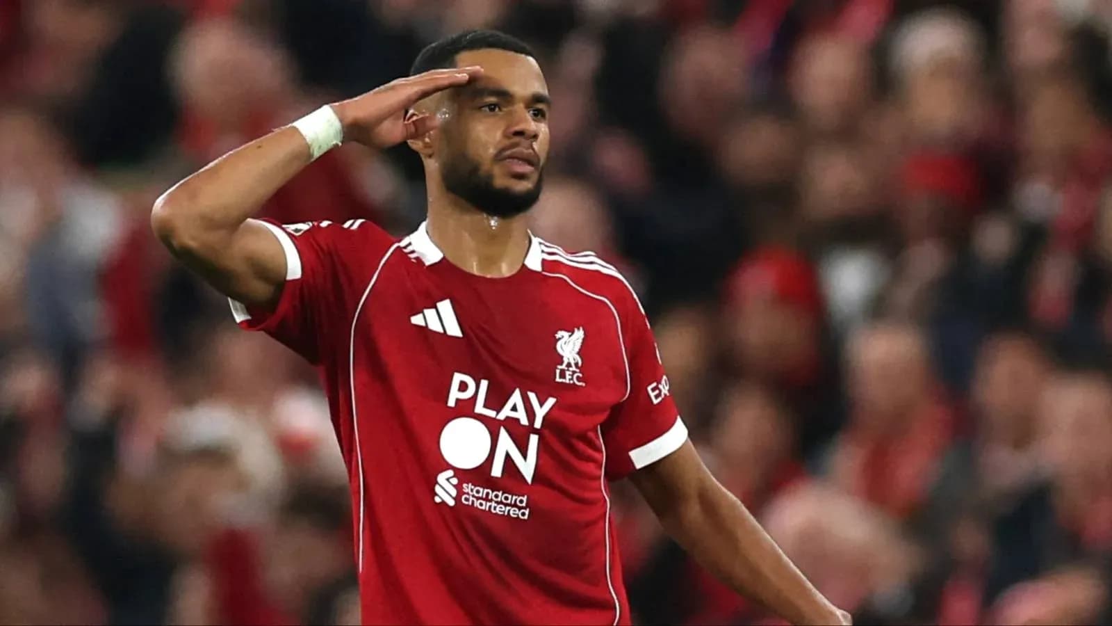 Player saluting fans during Liverpool match celebration