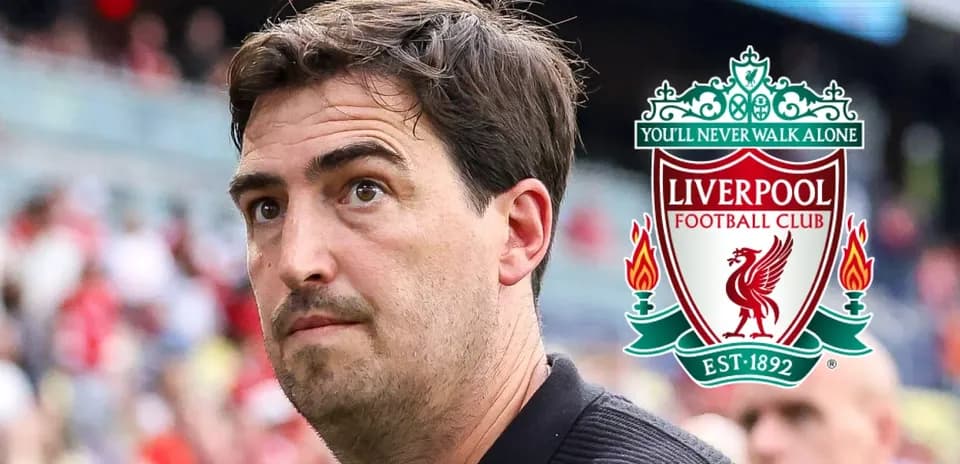 Man observing Liverpool FC logo during match