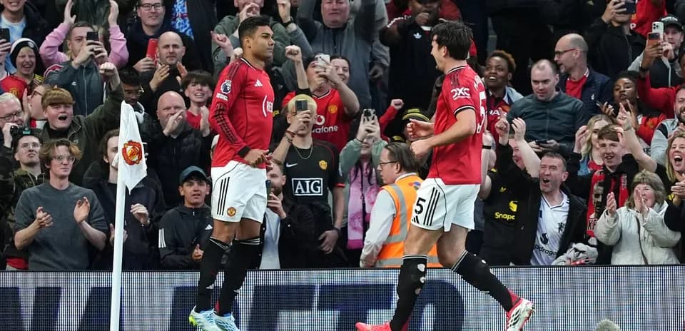 Manchester United players celebrating with fans