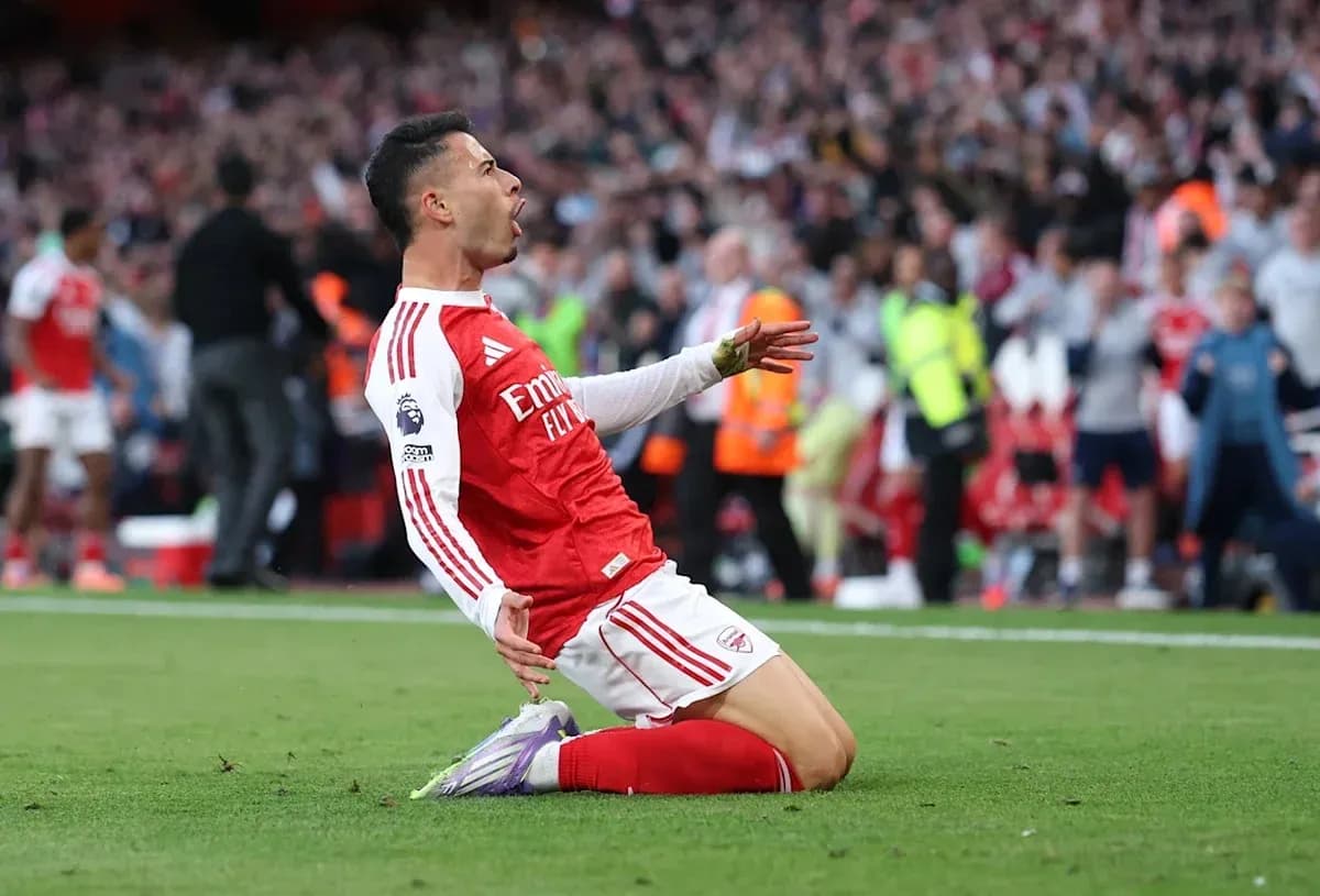 Player celebrating after scoring a goal on pitch