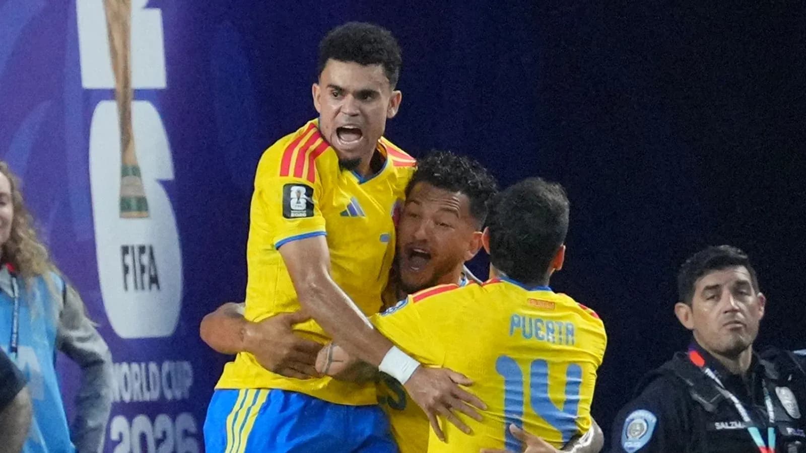 Players celebrating a goal during a match