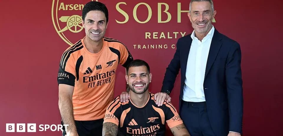 Manager and staff with player at signing ceremony
