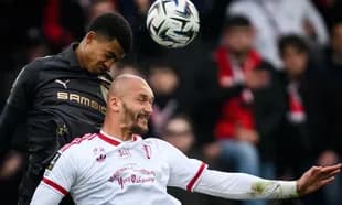Two players contesting a header during a match