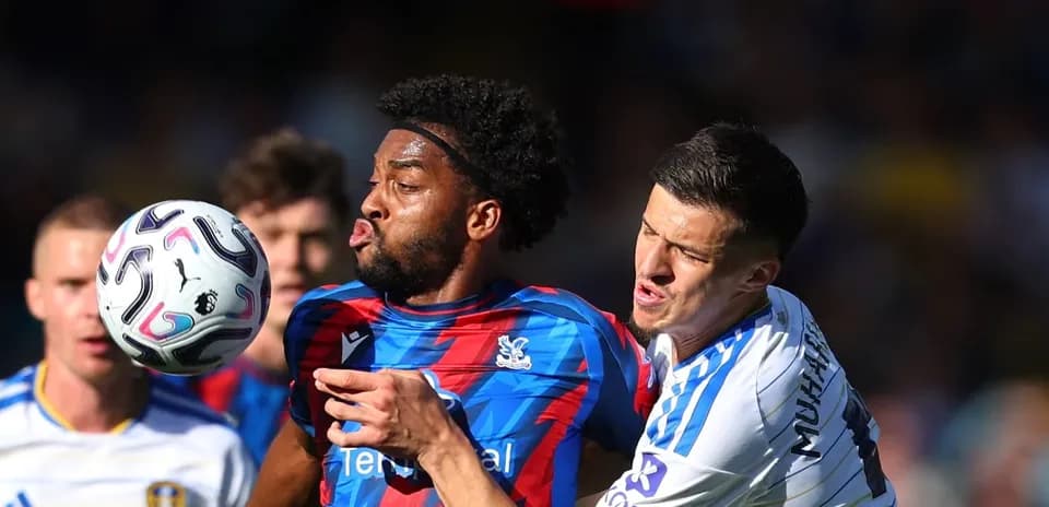 Two players contesting a ball during match action