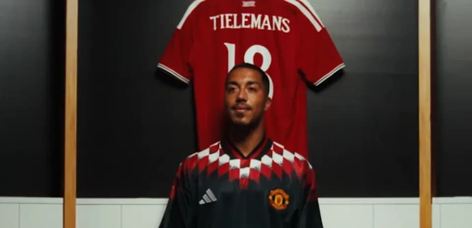 Player posing in Manchester United jersey with Tieleman’s shirt