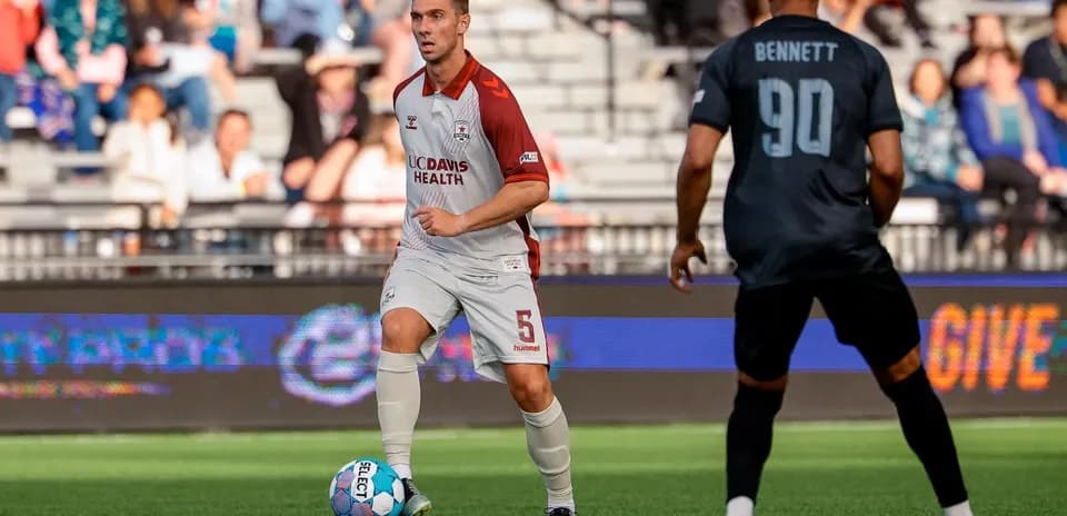 Player dribbling ball during Colorado Springs match
