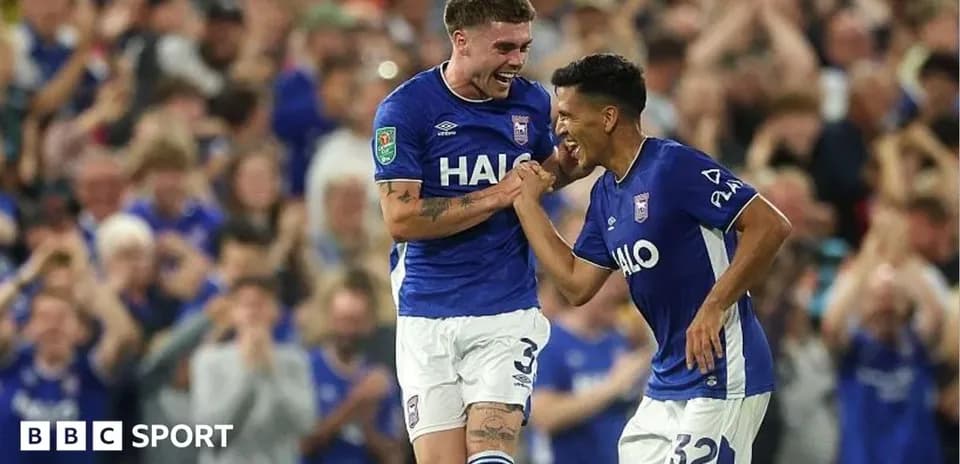 Two Ipswich Town players celebrating a goal