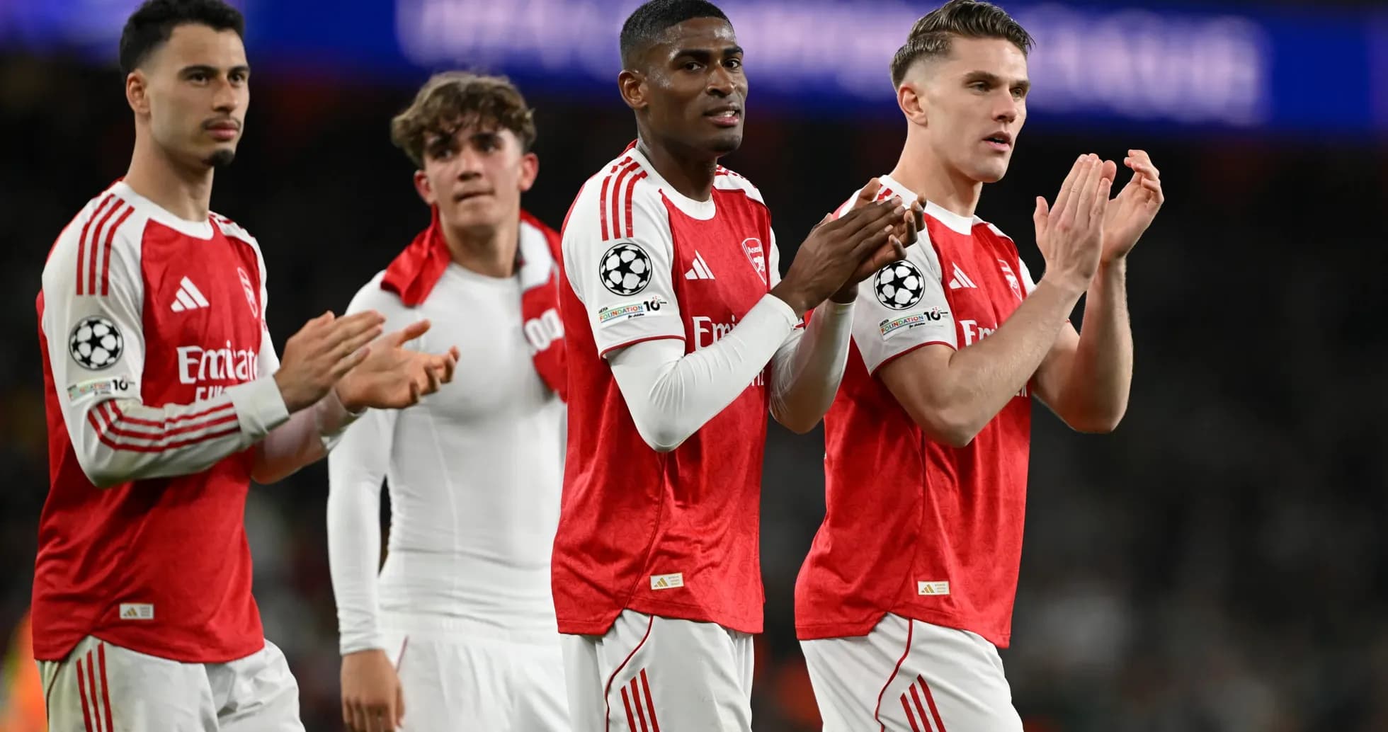 Arsenal players applauding fans after match