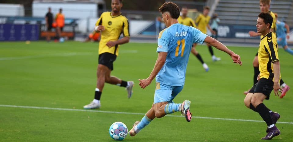Player kicking ball during JAX vs Charleston Battery match
