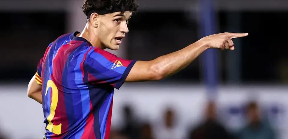 Player in Barcelona jersey directing teammates during match