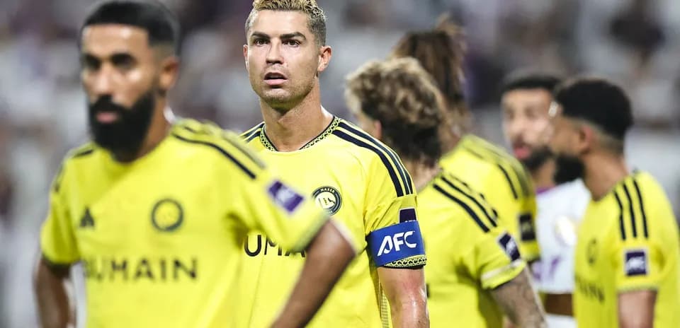 Cristiano Ronaldo and teammates in yellow jerseys during match