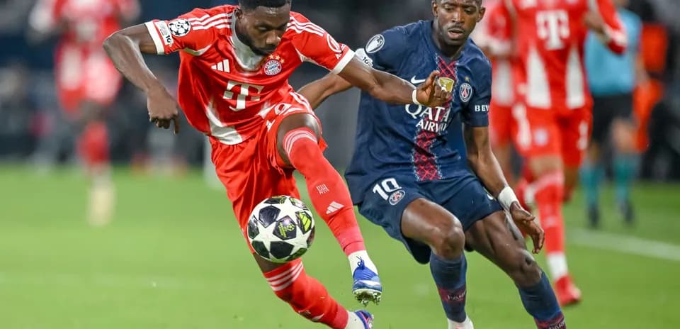 Player competing for the ball in Champions League match