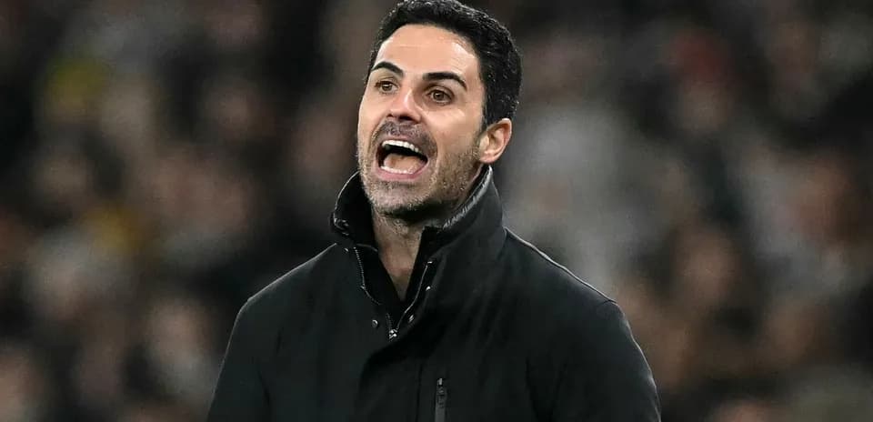 Manager gesturing and speaking on the sidelines