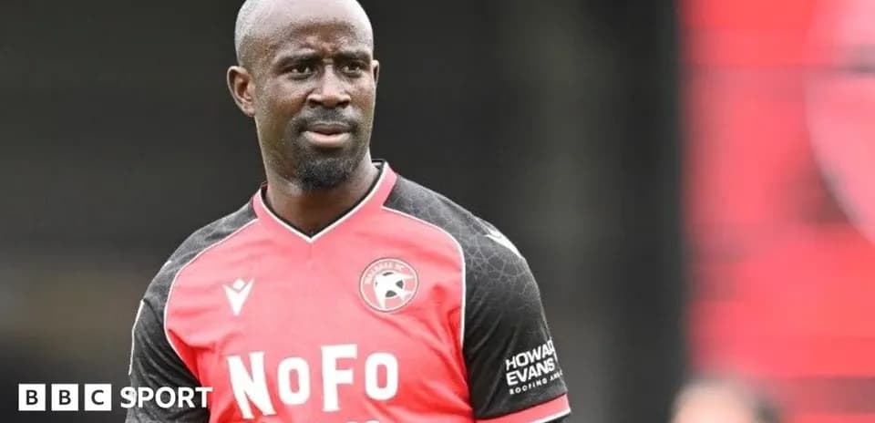 Player in red and black jersey on the field