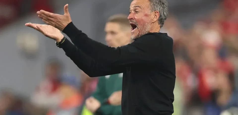 Coach gesturing passionately during a match