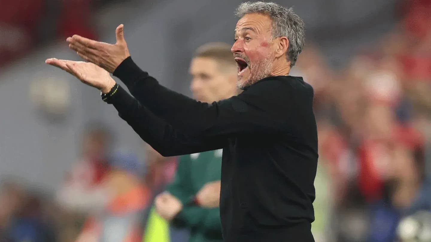 Coach gesturing passionately during a match