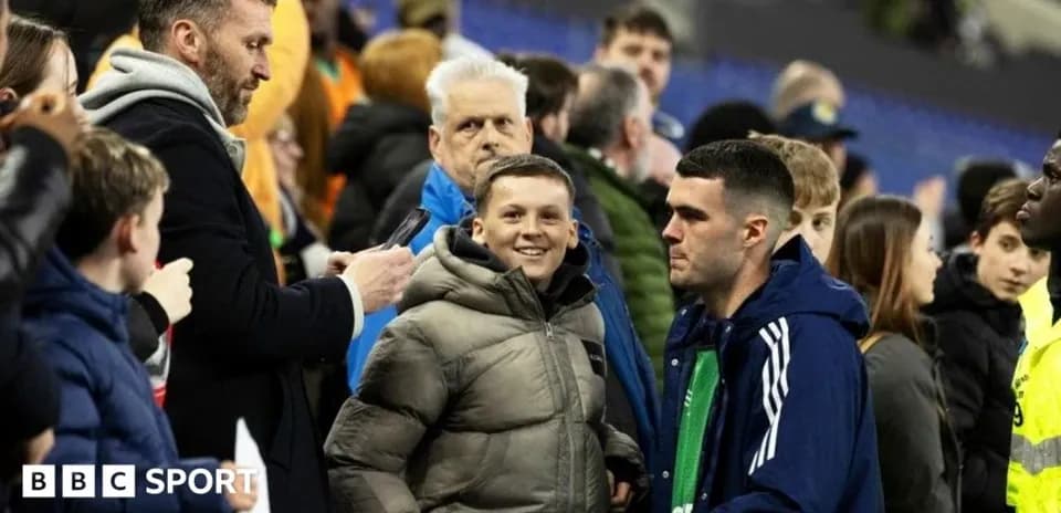 Fans interacting in the stands after a match