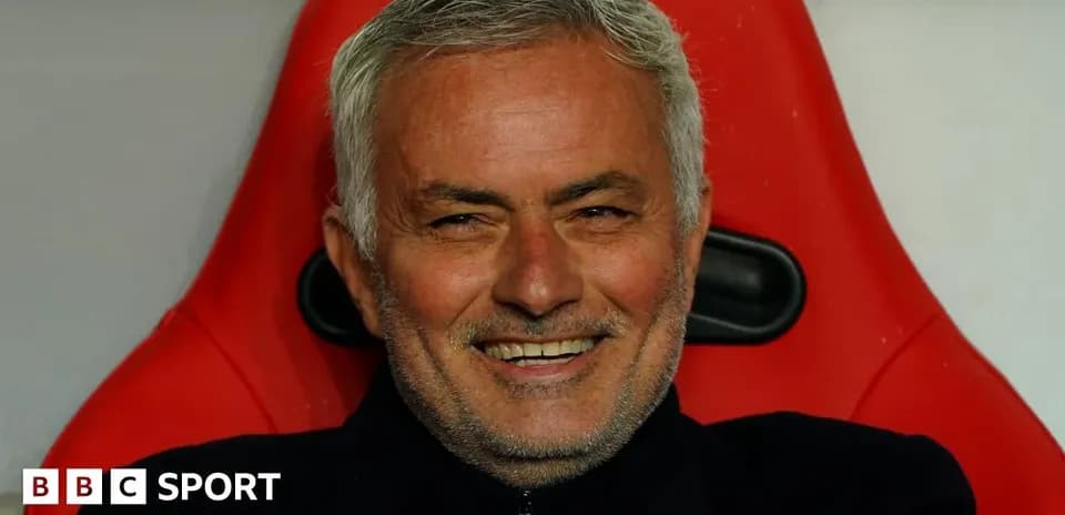 Manager sitting on bench during match
