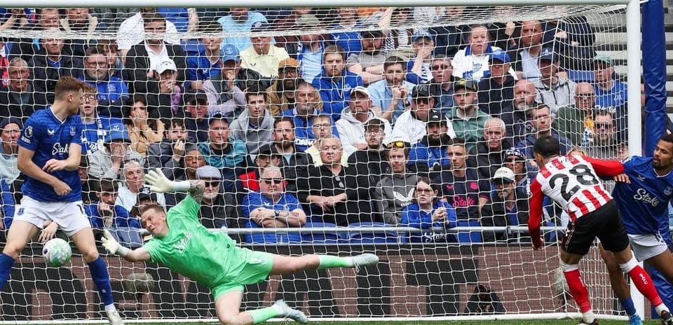 Goalkeeper saving a penalty during Everton match