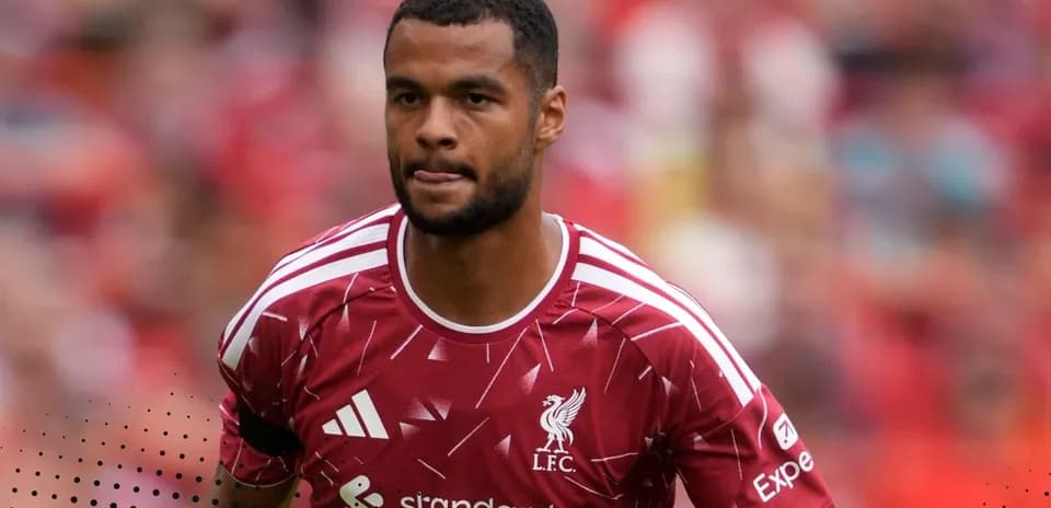 Player in Liverpool kit during match warm-up