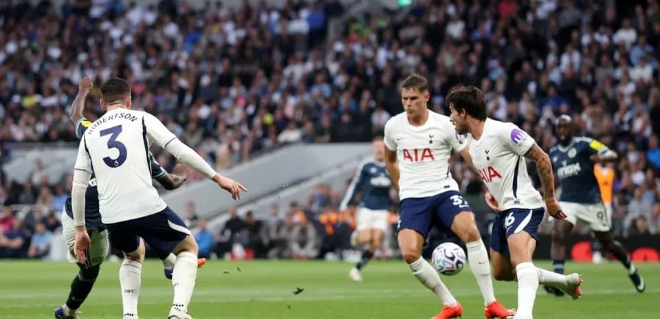 Tottenham players defending against an attacking player