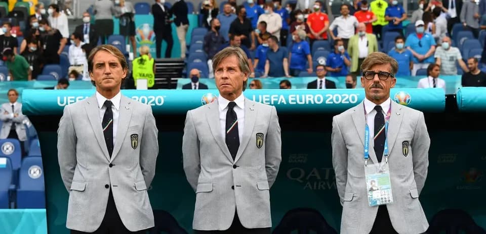 Coaching staff standing before UEFA Euro 2020 match