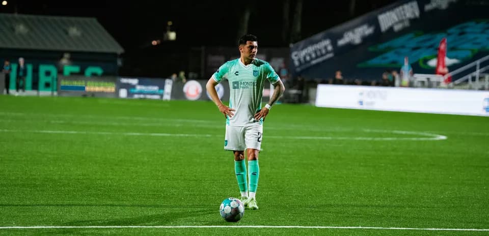 Player preparing for a free kick during match