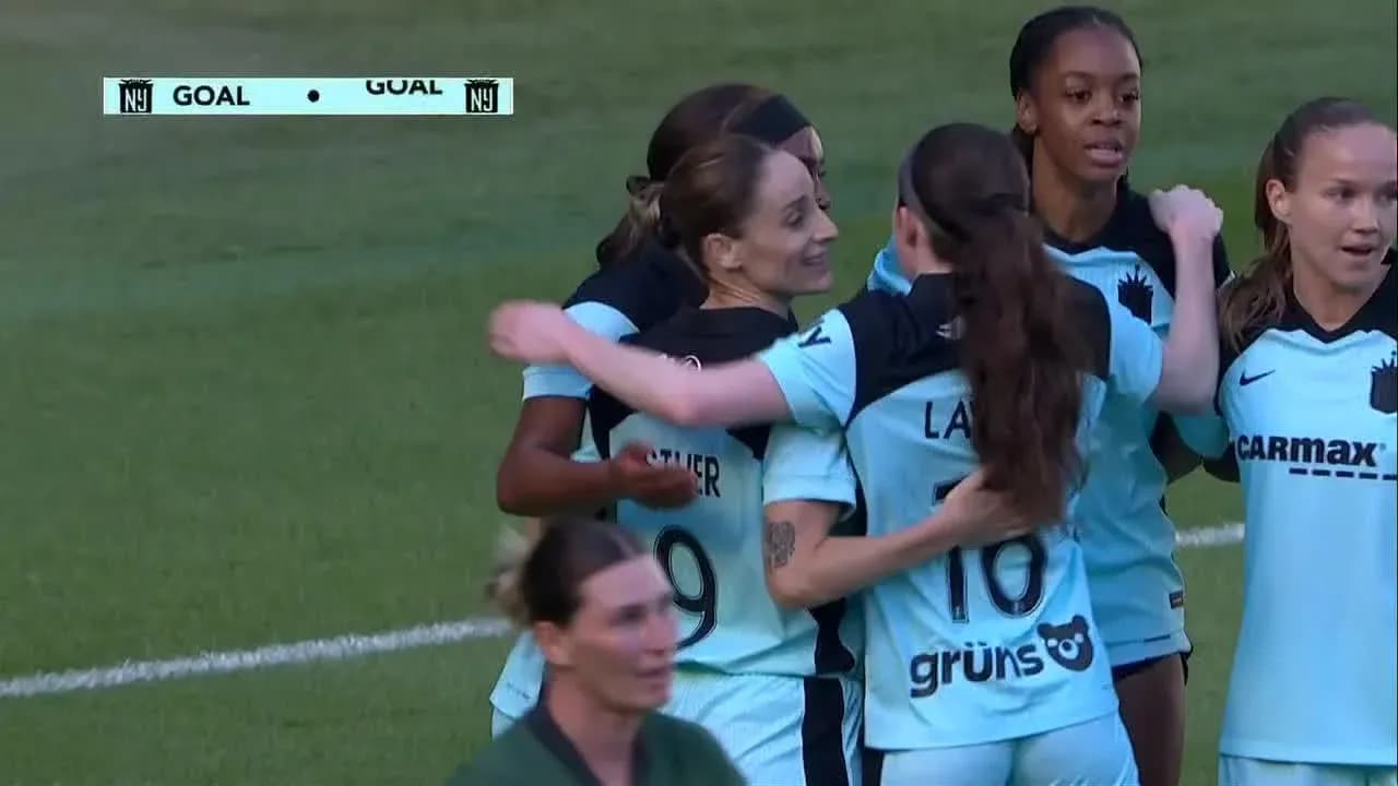 Players celebrating a goal during match
