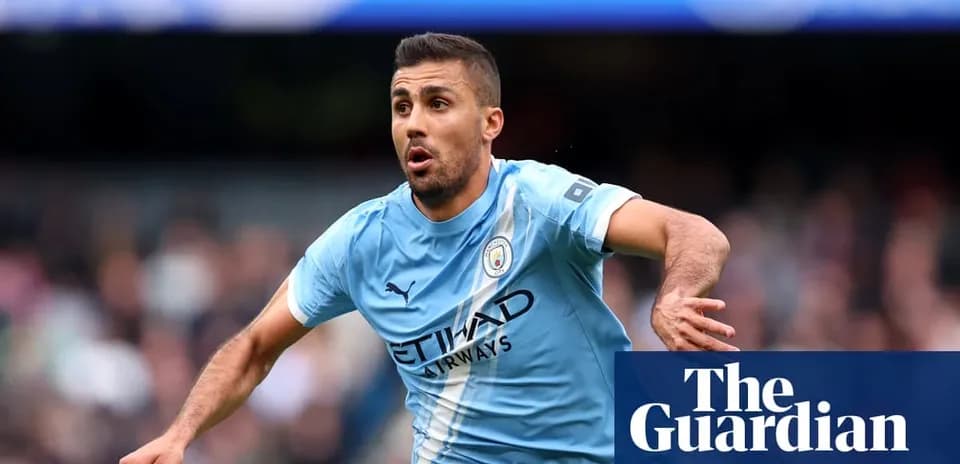 Player celebrating during a match wearing Manchester City jersey