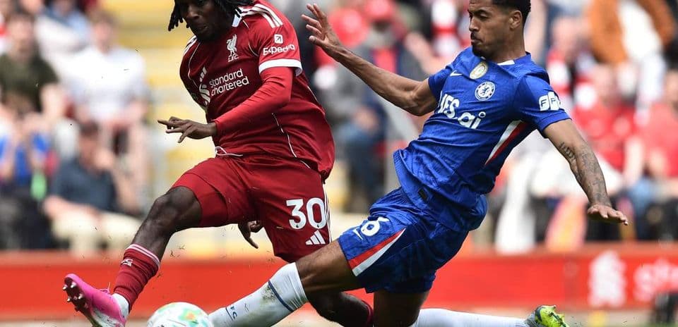 Two players contesting the ball during match action