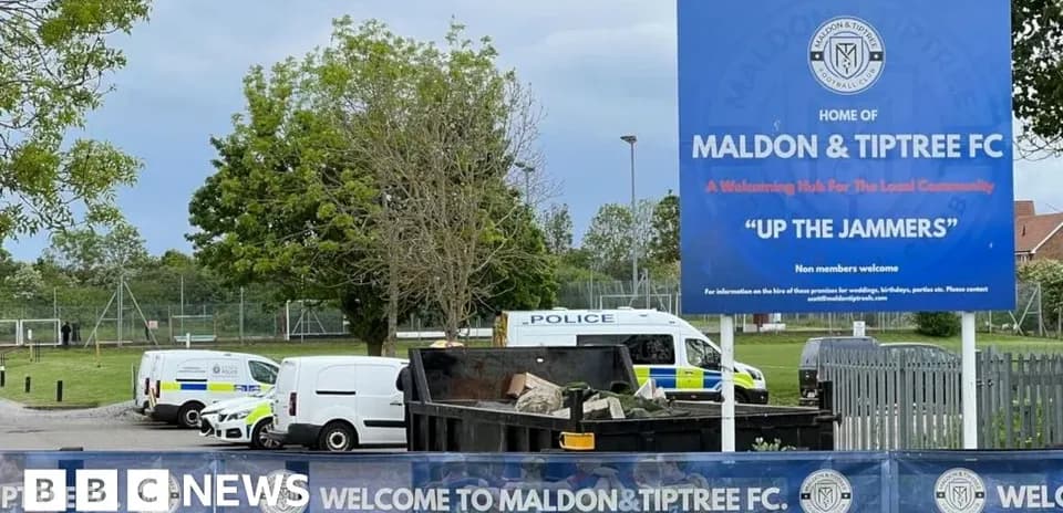 Maldon & Tiptree FC stadium entrance with police vehicles