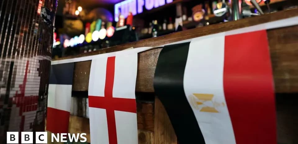 Flags of England, France, and Egypt displayed in pub