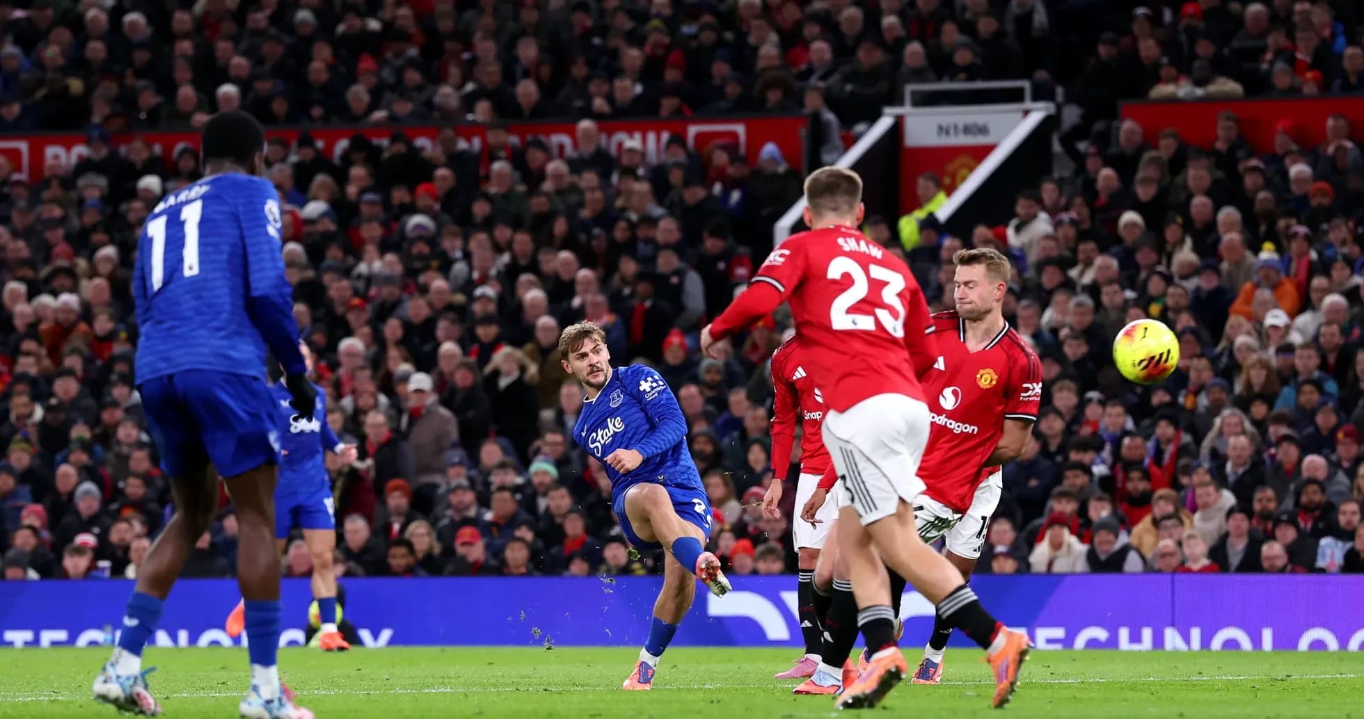 Everton player striking the ball during match