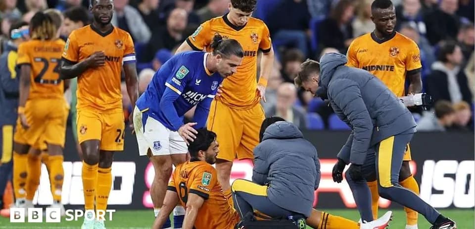 Medical staff attending to injured player on field