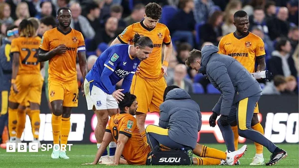 Medical staff attending to injured player on field