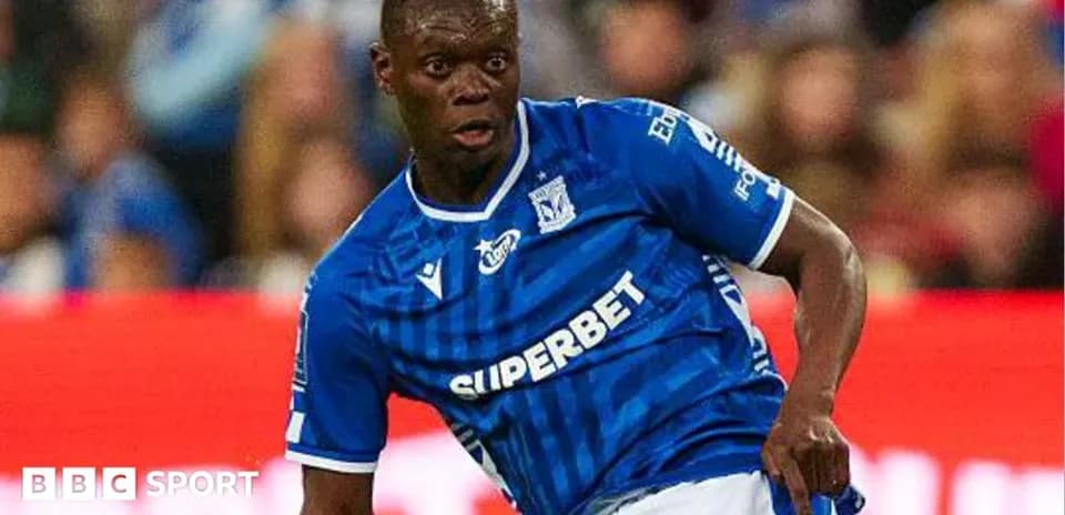 Player in blue kit during match action