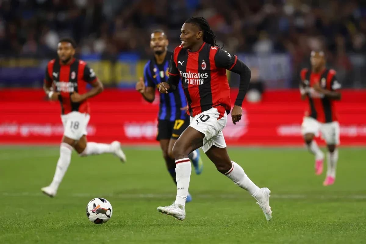 AC Milan player dribbling ball during match