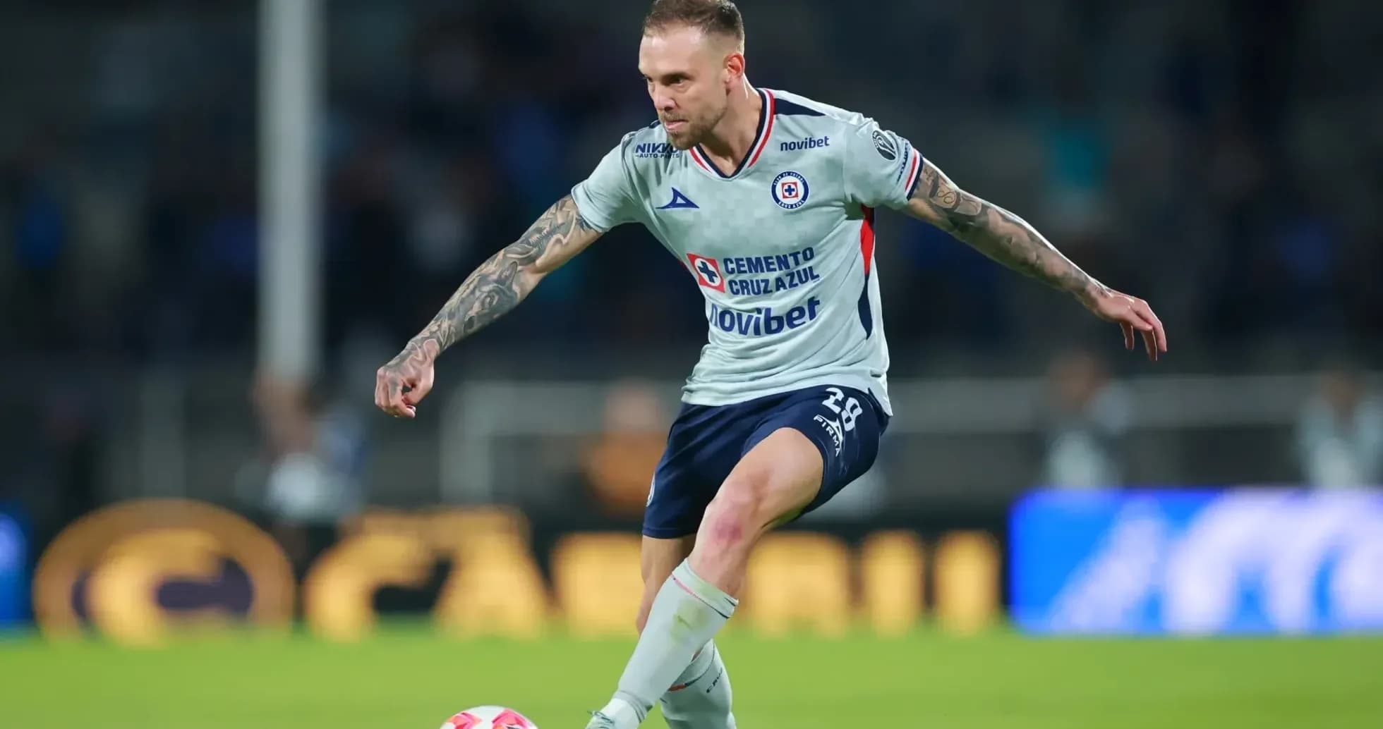 Cruz Azul player kicking the ball during match