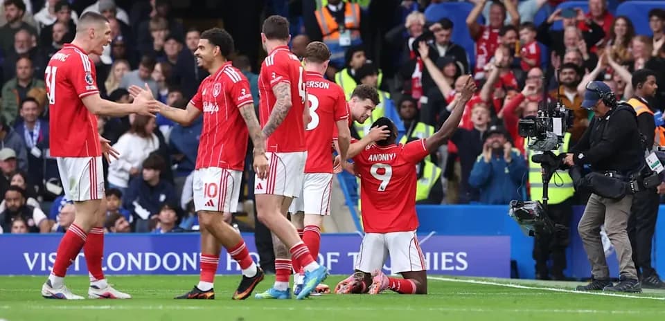 Players celebrating a goal during a match