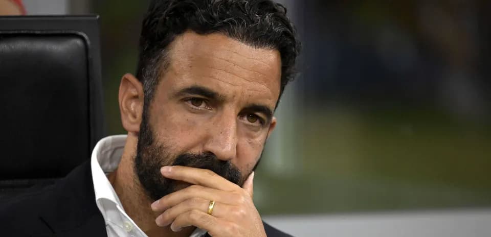 Coach contemplating during a match on the sidelines