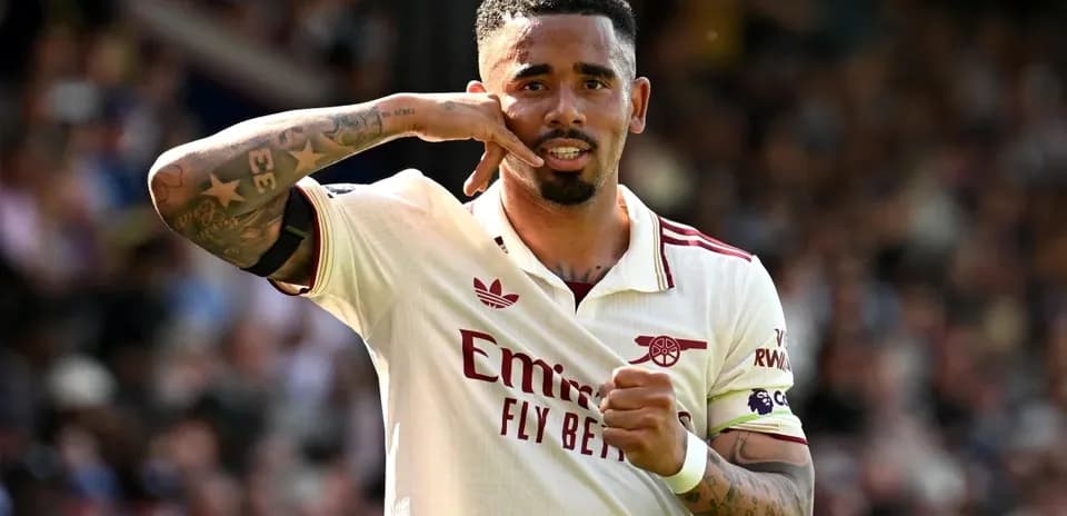 Player celebrating with phone gesture after scoring
