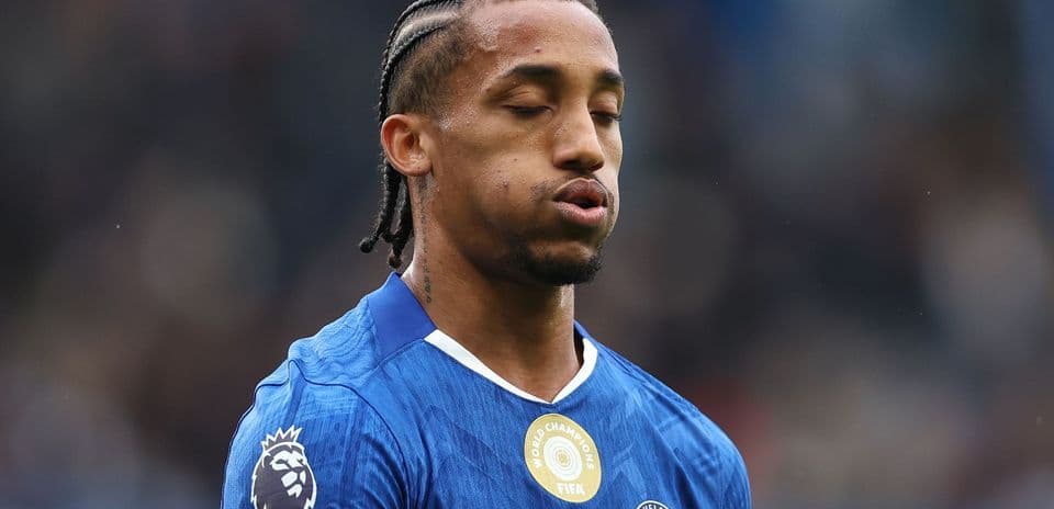 Player in blue jersey during match with closed eyes