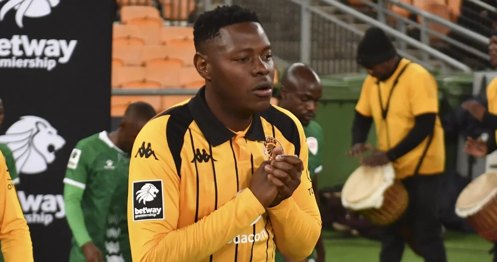 Player in Kaizer Chiefs jersey entering the field
