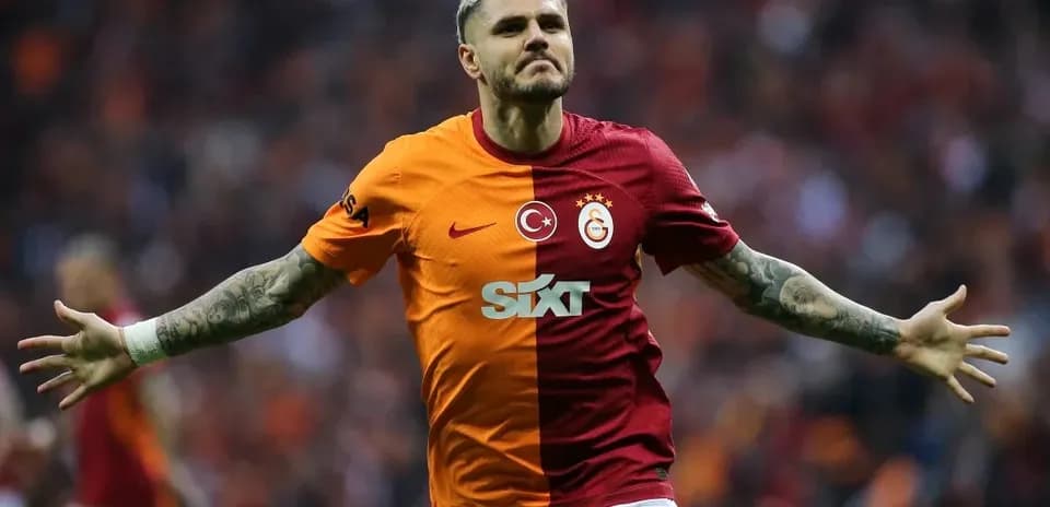 Player celebrating a goal in Galatasaray kit