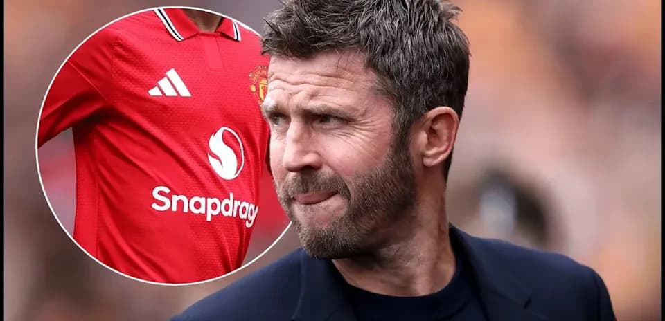 Football coach observing match with Manchester United shirt