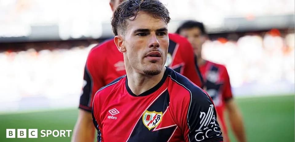 Player in red and black jersey during match